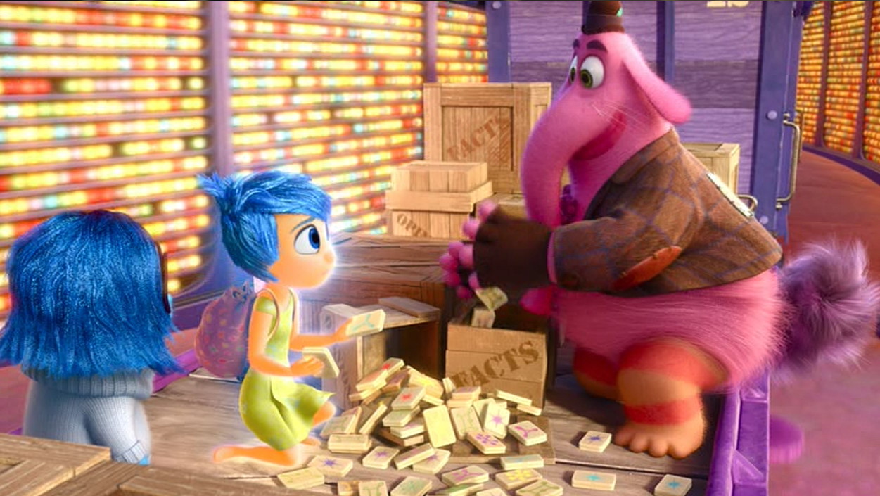 A scene from Pixar's "Inside Out" that shows a pink elephant and two characters sorting through blocks labelled "facts" and "opinions"