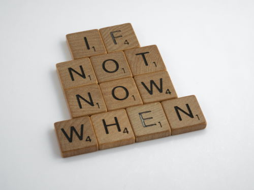 Blocks of wood that spell "If not now when"