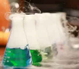 Photo of colourful beakers in a science experiment.